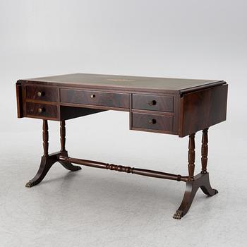 A mahogany veneer desk with desk chair, 20th Century.