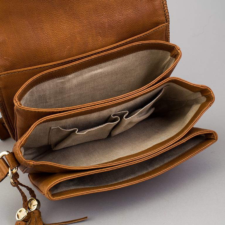 A 'Marrakech Medium Messenger Bag' by Gucci.