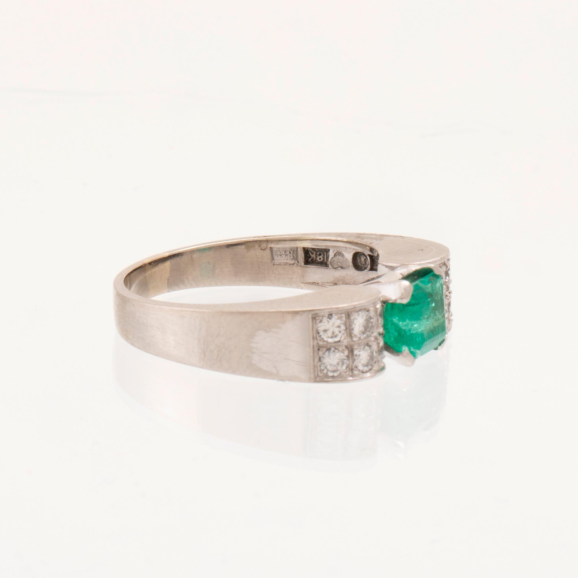W.A. Bolin, ring 18K white gold with a rectangular step-cut emerald and round brilliant-cut diamonds, Stockholm 1976.