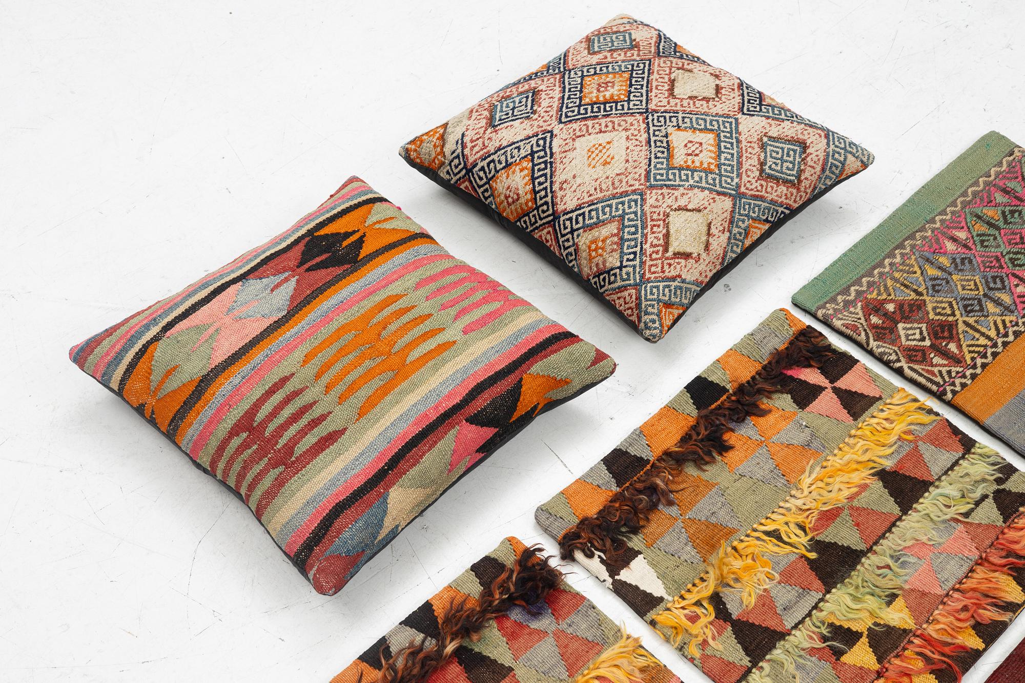 Nine Kilim pillow cases and two Kilim pillows, around 1970, ca. 50 x 50 cm.