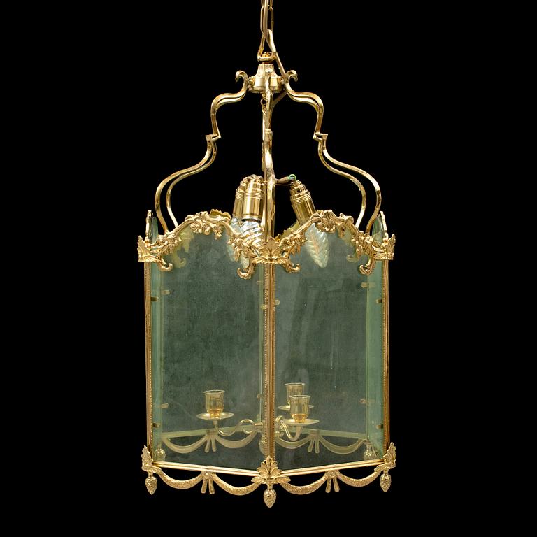 A brass ceiling light "Jubileumslyktan" by K.A. Jonsson, signed and dated 2002.