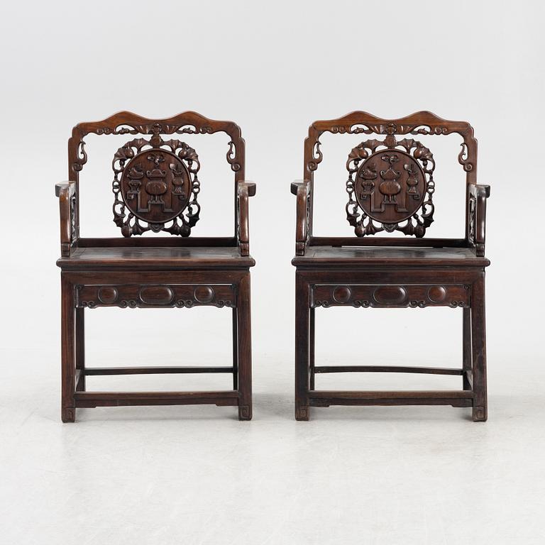 A pair of hardwood armchairs, China, late Qing dynasty/around 1900.