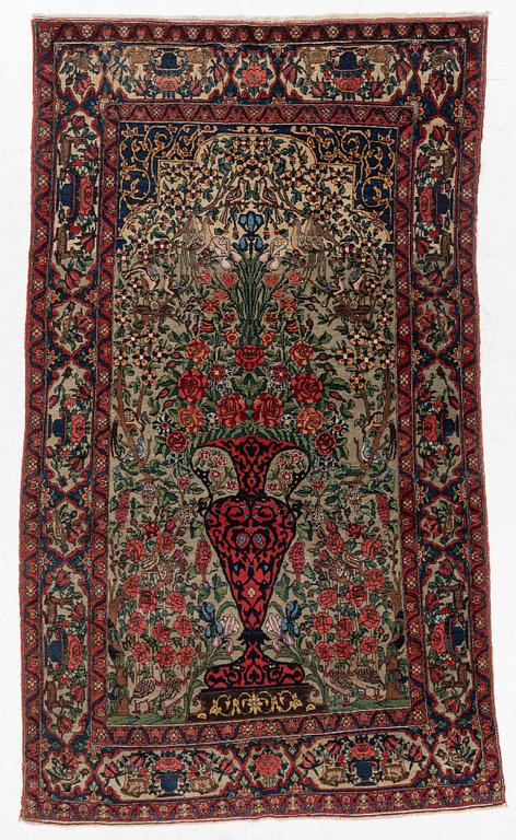 A figural oriental rug, c.. 230 x 130 cm.
