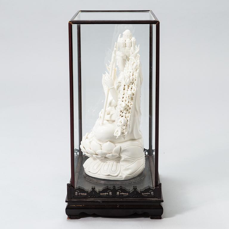 An oriental Buddha statue in porcelain.