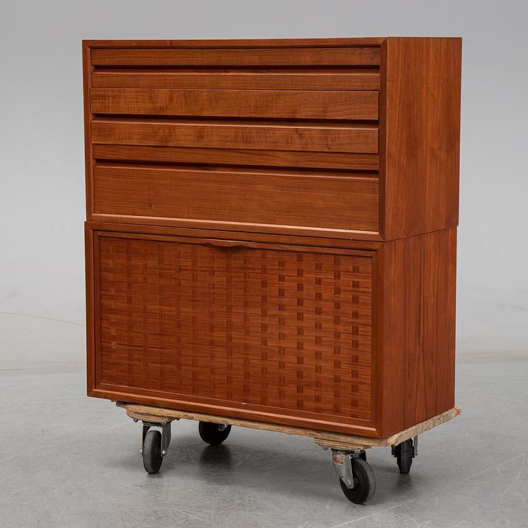 A 1960's teak shelving system by Poul Cadovius.