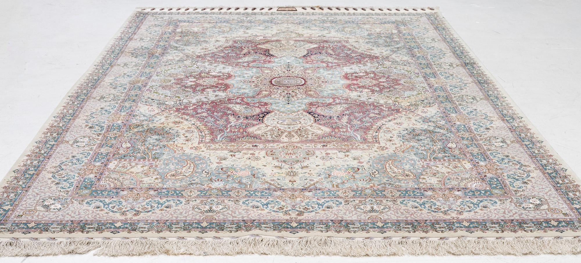 A Tabriz, carpet, 310 x 195 cm. signed.
