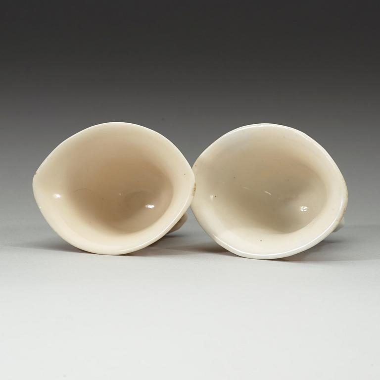 A pair of blanc de chine libation cups, Qing dynasty 18th century.