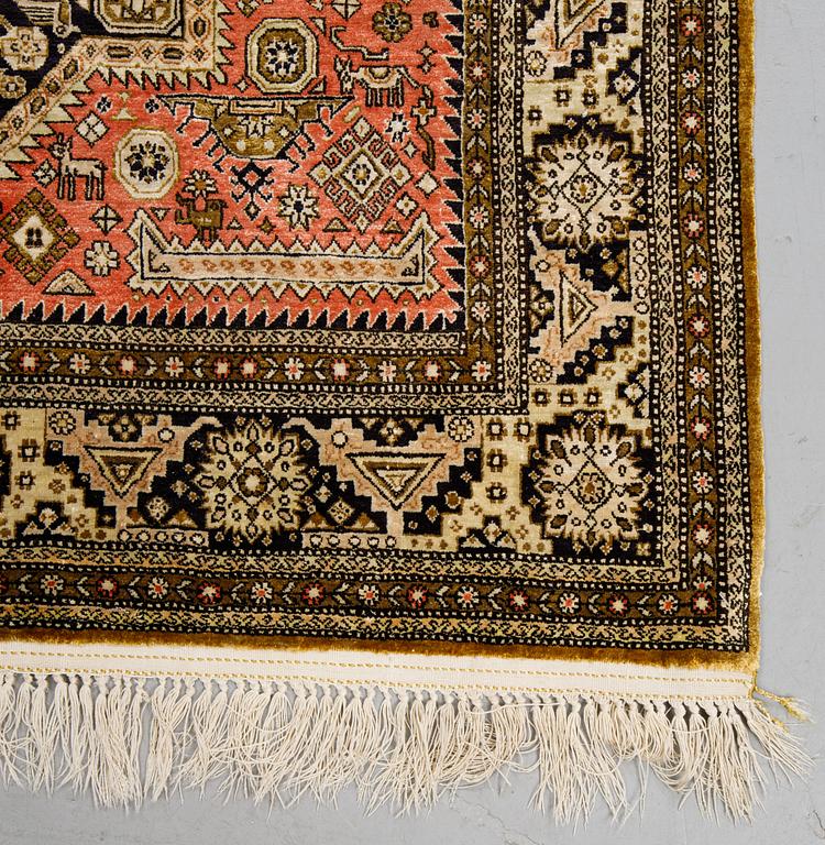 A rug, an old silk Qum, ca 158 x 104,5 cm (as well as ca 2 cm flat weave at the ends).