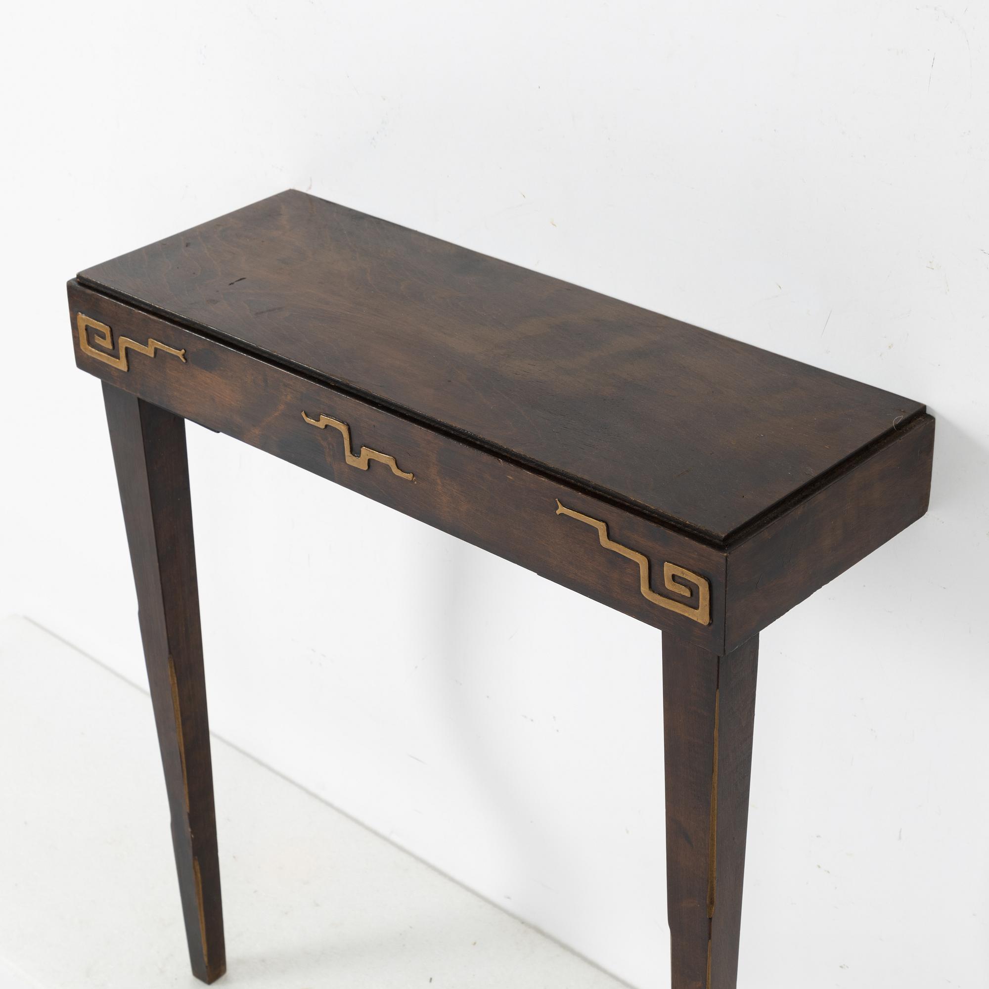 A Swedish Grace mirror and a console table, 1920's/30's.
