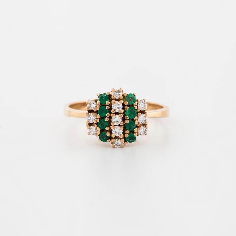 An emerald and brilliant cut diamond ring.