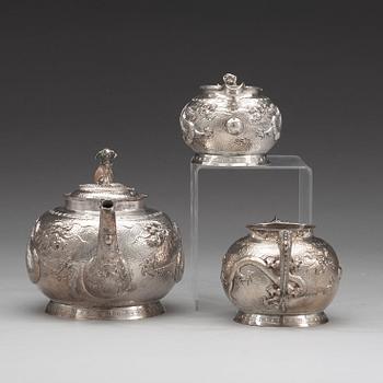 A Chinese three piece silver tea set, early 20th Century.