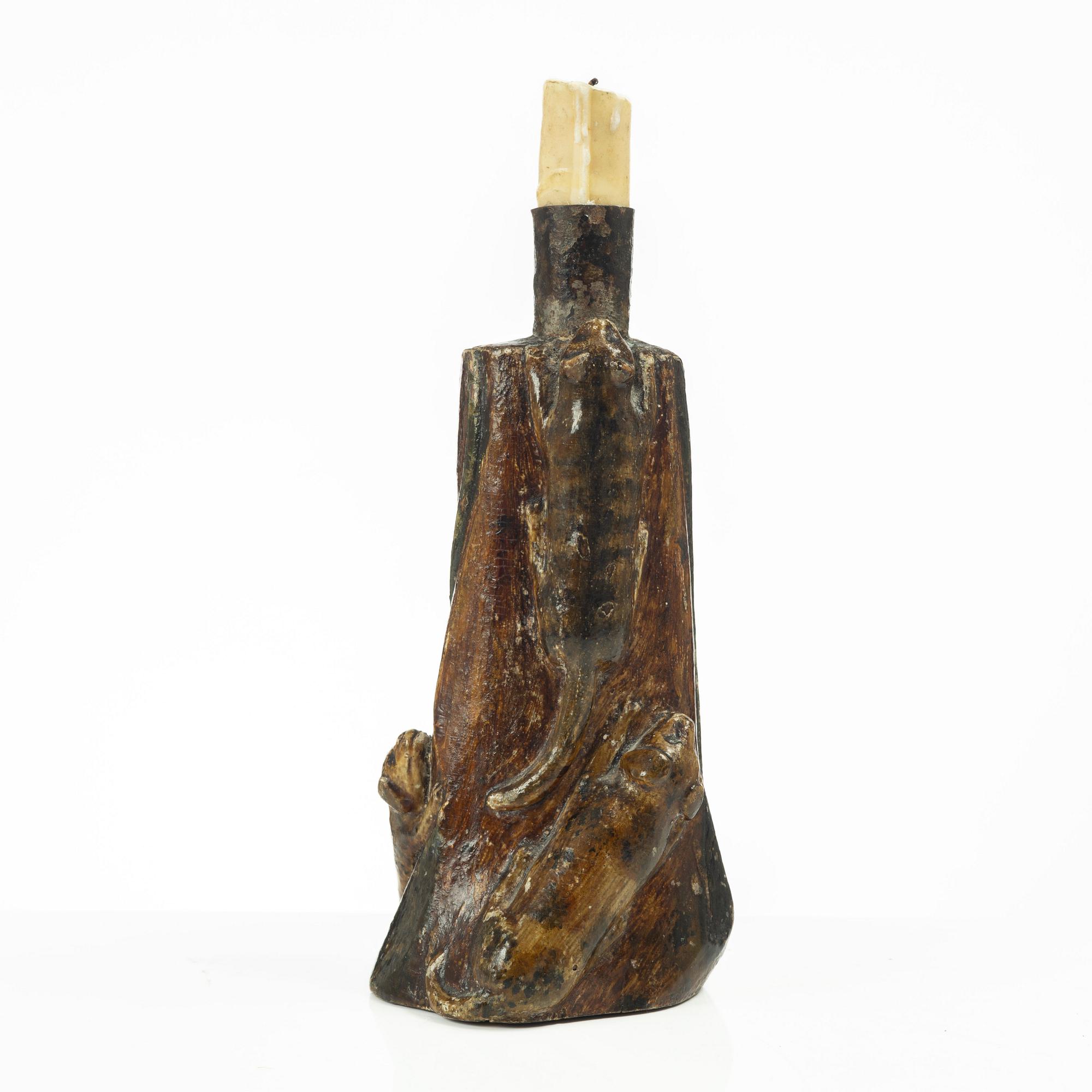 A Swedish folk art carved candlestick, 19th century.