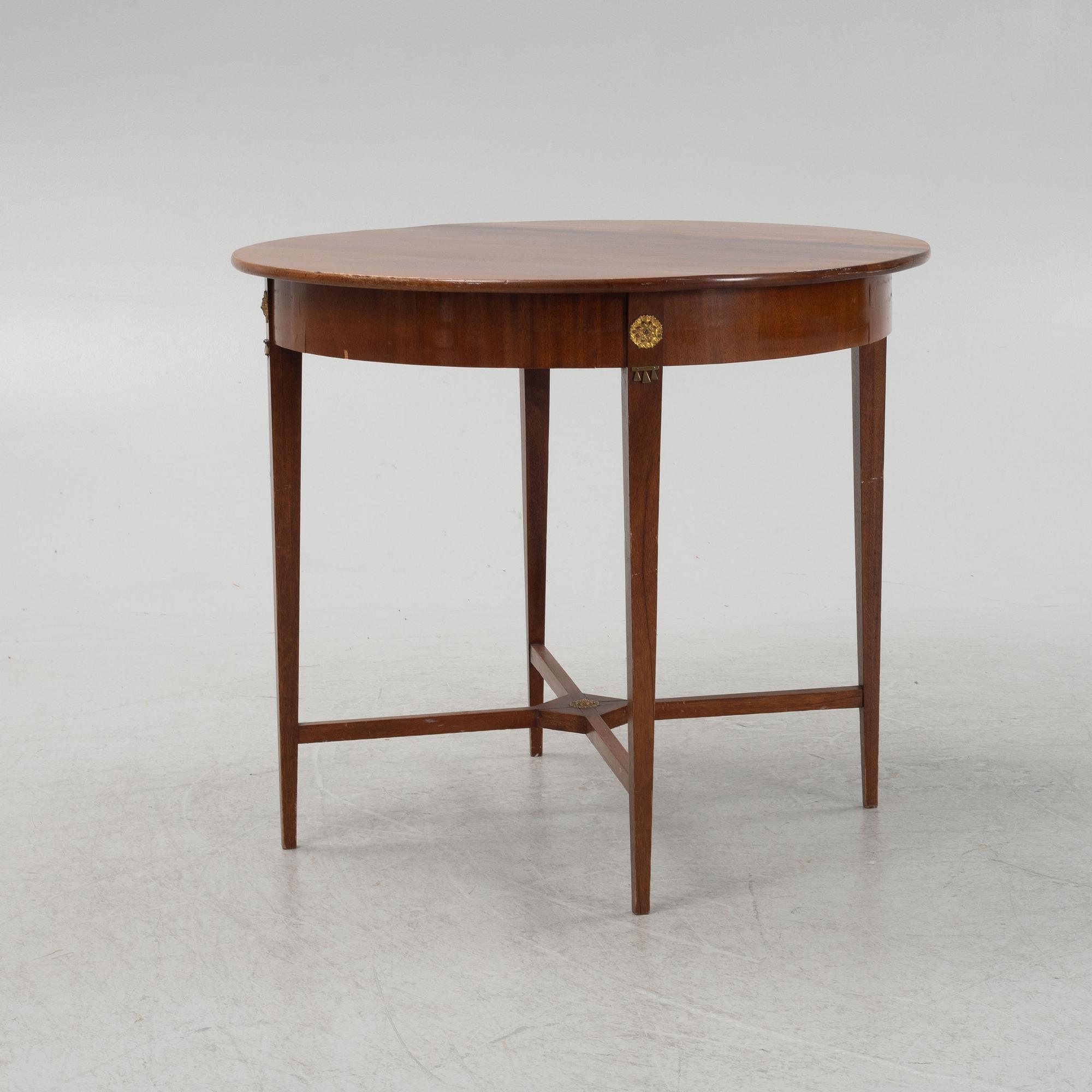 A mahogany veneered table, late 19th century.