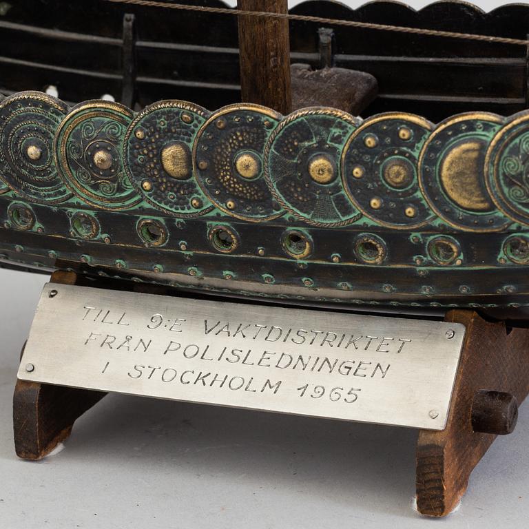 A min 20th century model of a viking ship, brass and copper.