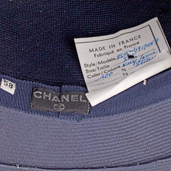 CHANEL, a navy blue hat.
