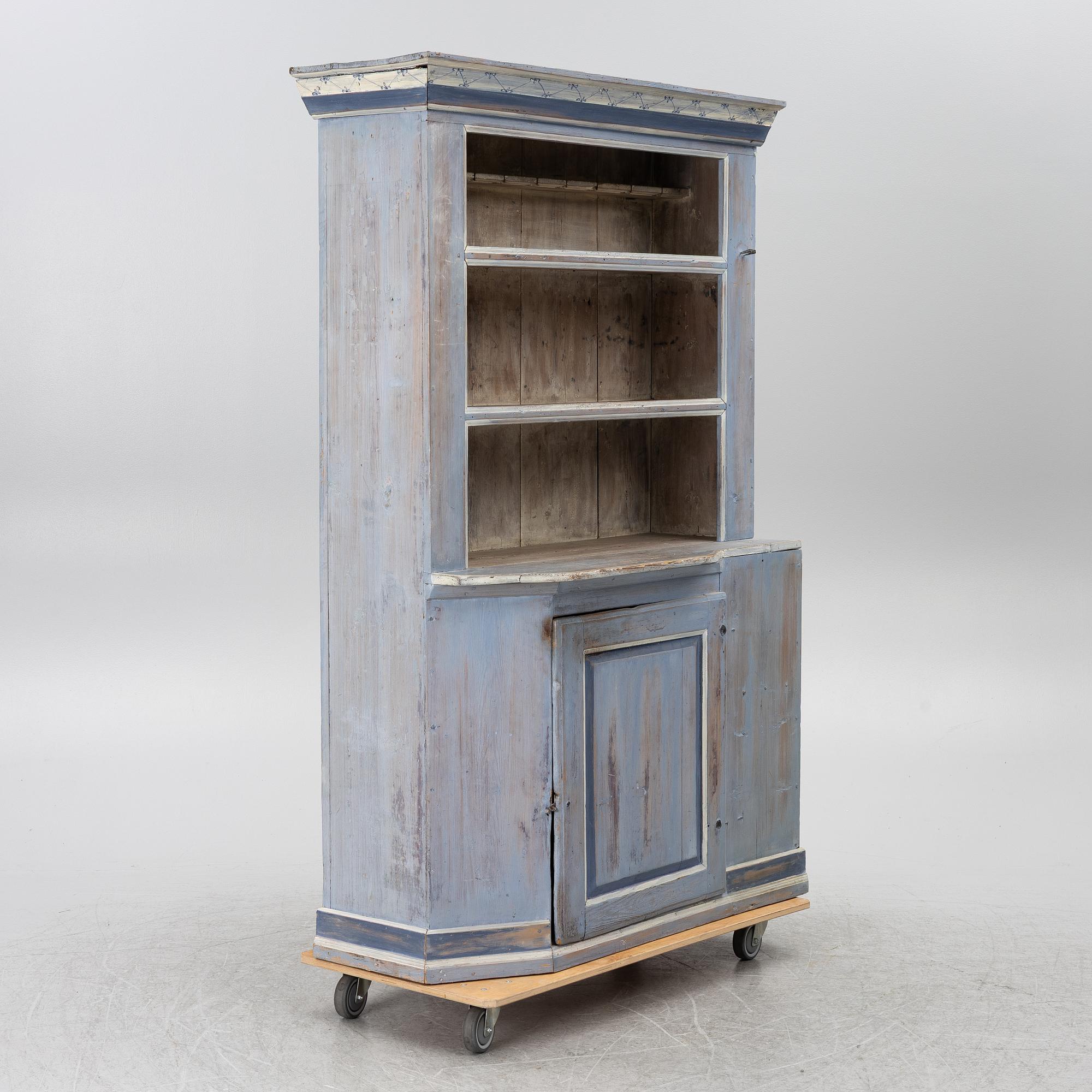 A painted folk-art cupboard, early 19th century.