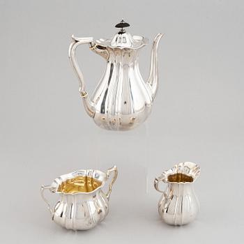 A swedish parcel-gilt coffee pot, creamer and suga bowl.