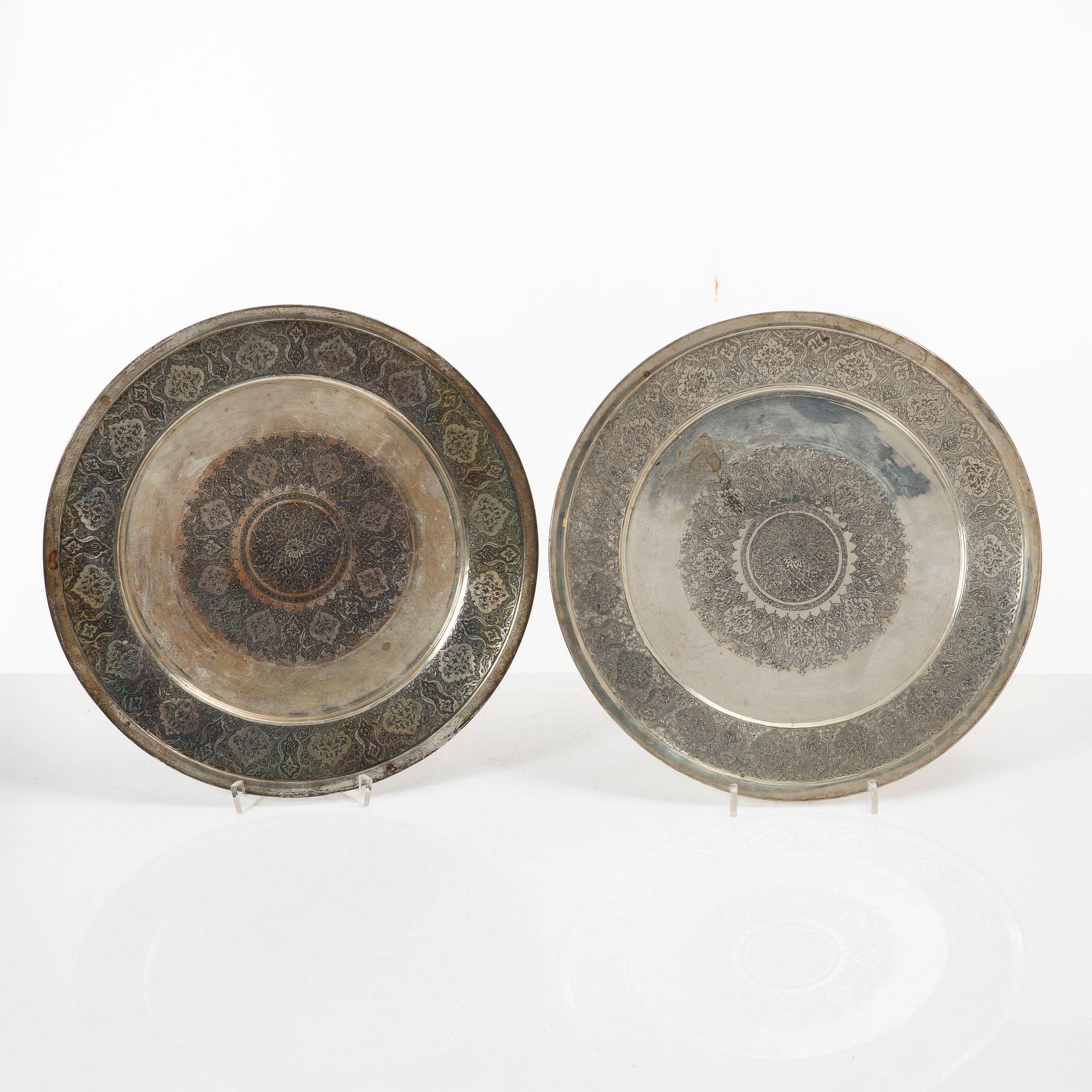 A pair of Persian silver plates, 20th century.