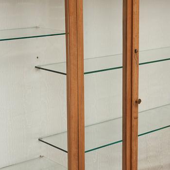 A Josef Frank mahogany showcase cabinet, a version of model 2077, by Svenskt Tenn.