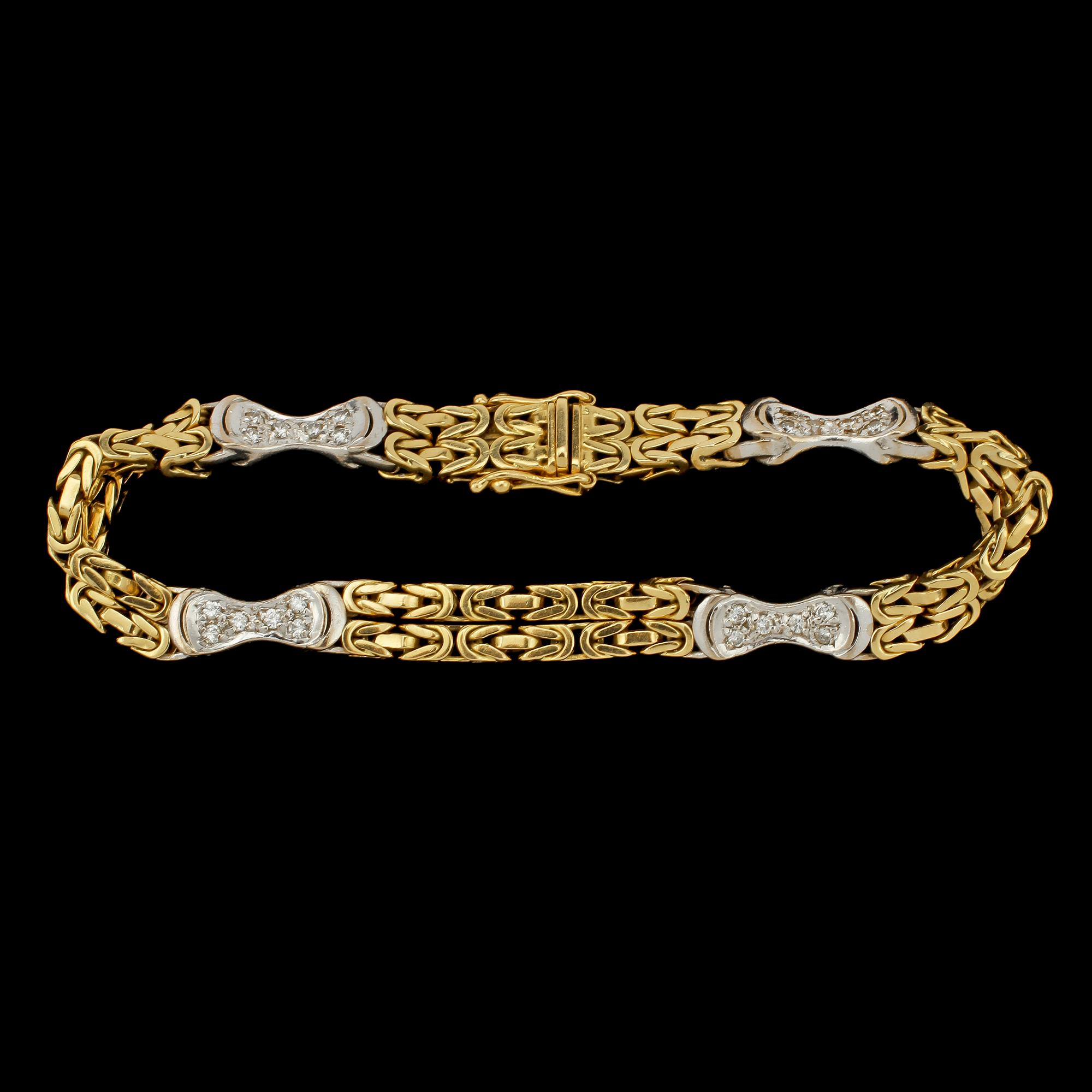 ARMLÄNK, 18k guld och vitguld med 24 små briljantslipade diamanter, tot 0.43 ct, importstämplat. Vikt 28 g.