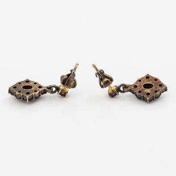 Pendant and a pair of earrings, gilt metal with garnets.