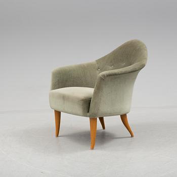 A easy chair "Lilla Adam" by Kerstin Hörlin-Holmquist.