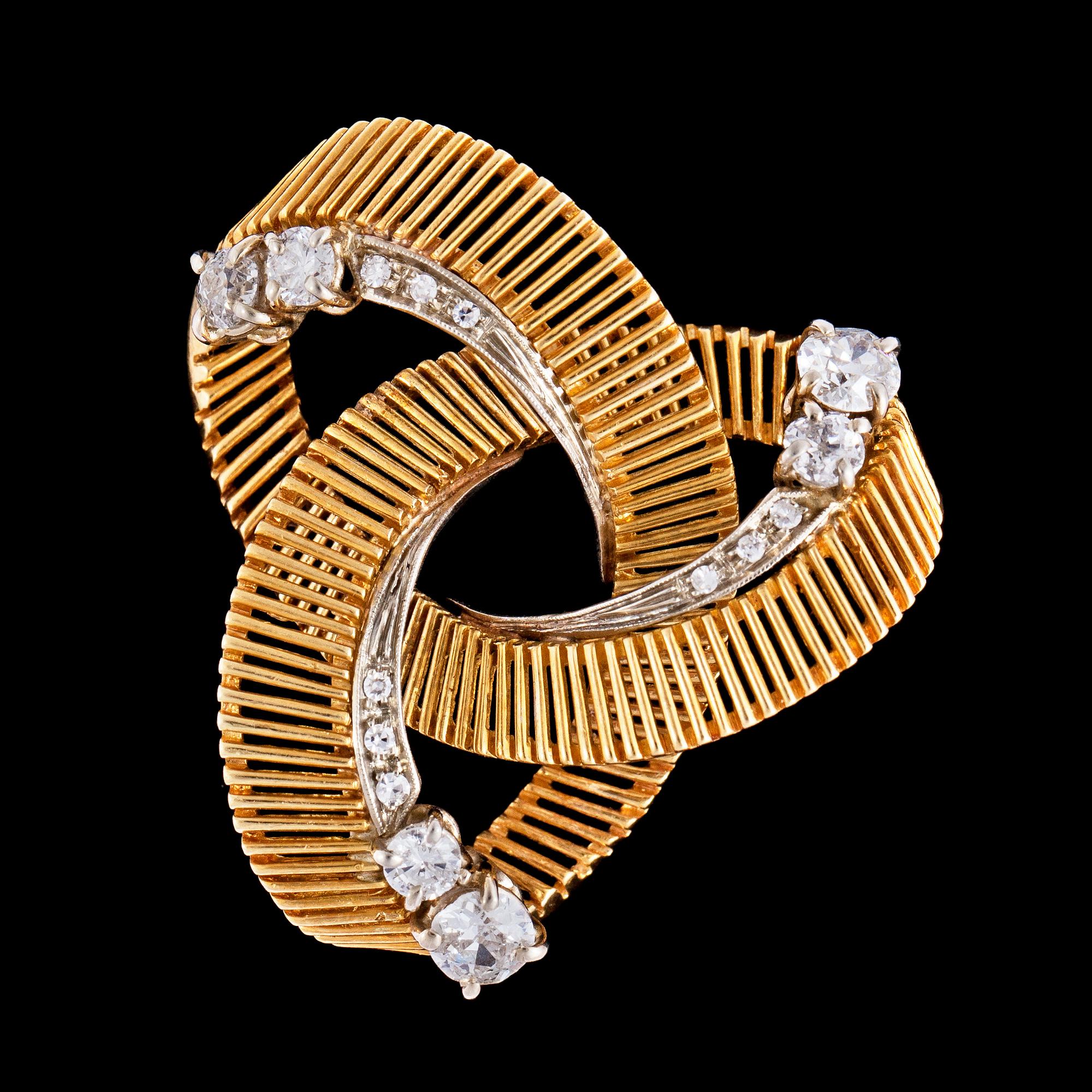 A brilliant cut diamond brooch, tot. app. 1.50 cts. 1950's.