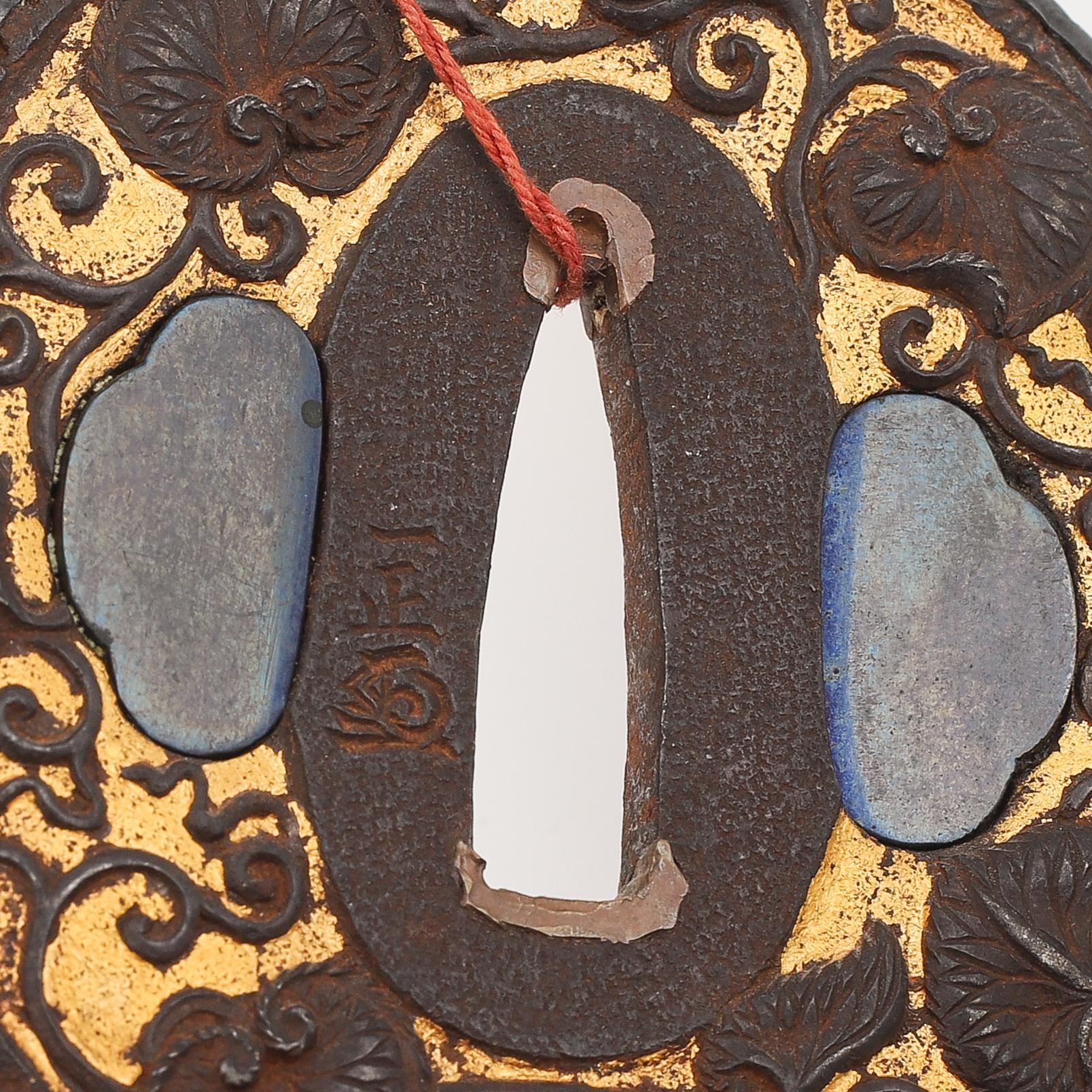 Five tsubas, 18/19th Century, one signed.