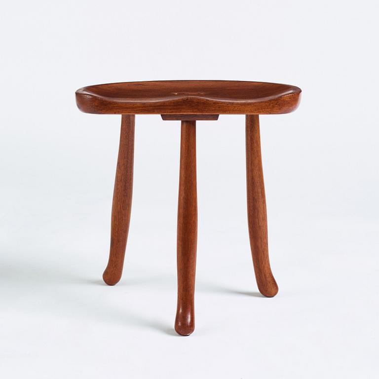 Josef Frank, a three legged mahogany stool, model 336, Svenskt Tenn, Sweden 1940-1950s.