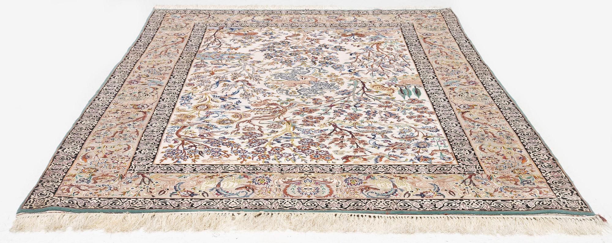 A signed pictoral Isfahan rug, Central Persia (Iran), signed, c. 235 x 154 cm.