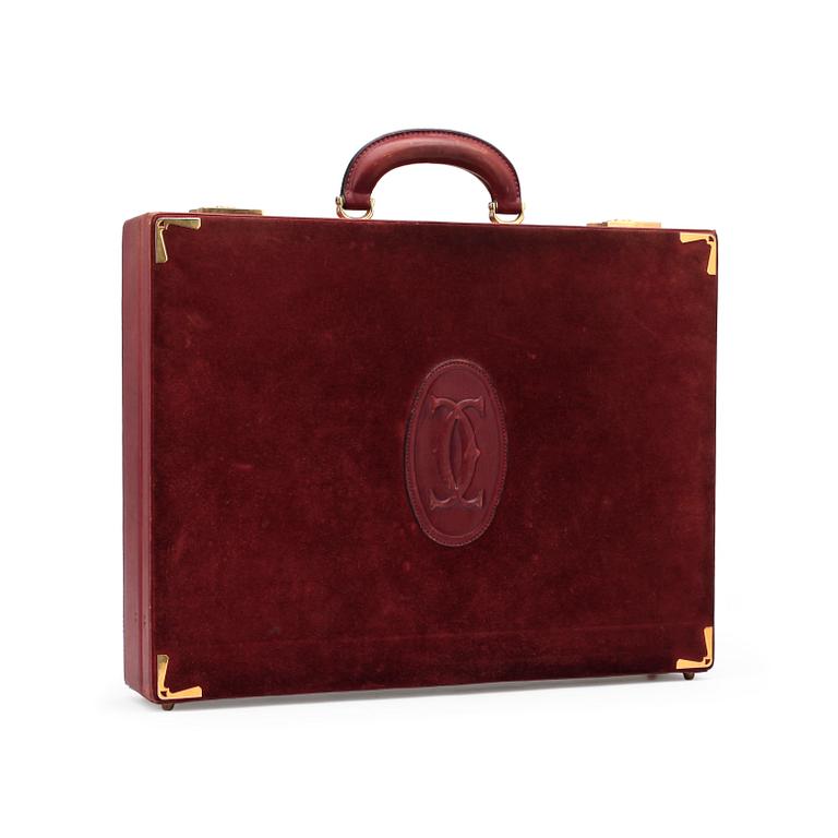 CARTIER, a red leather briefcase.
