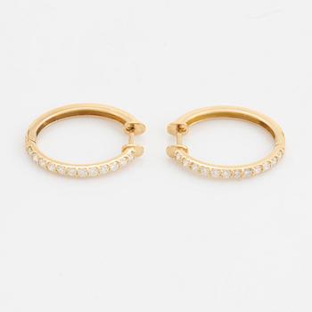 Brilliant cut diamond hoop earrings.