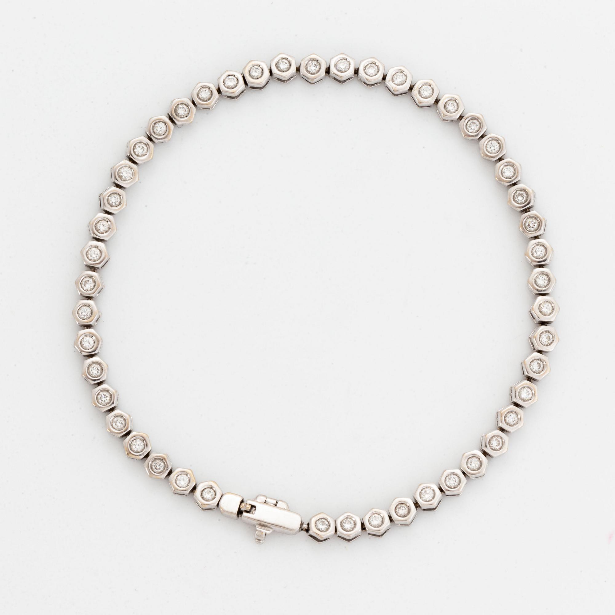 Tennisarmband, vitguld och briljantslipade diamanter.