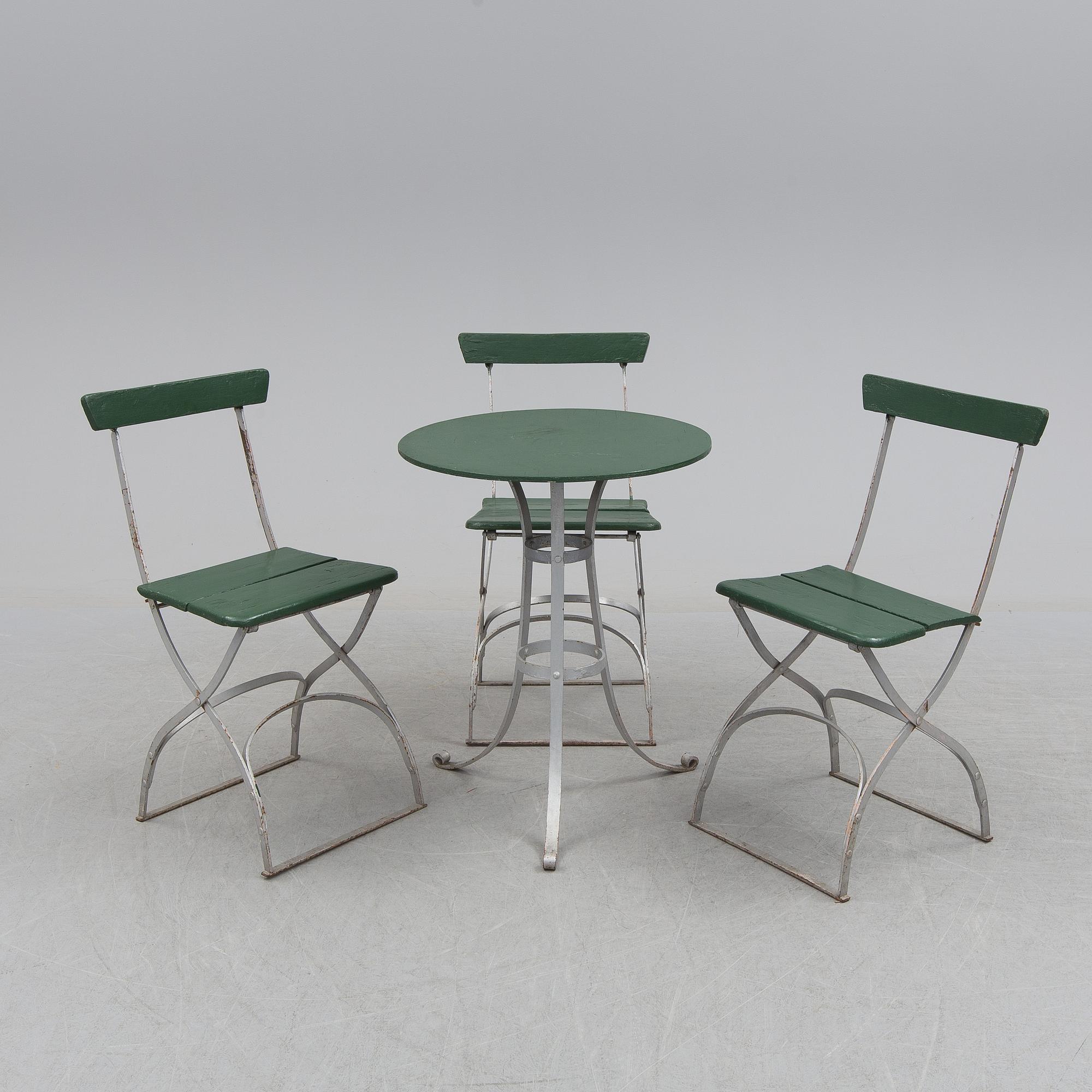 A garden table and four chairs, first half of the 20th century.