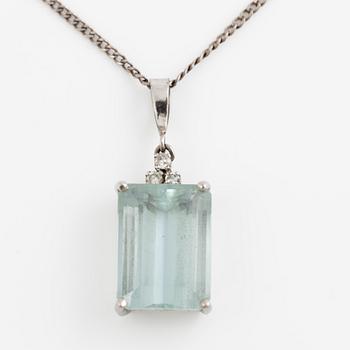 Pendant with emerald-cut aquamarine and octagonal-cut diamonds, with a silver chain.
