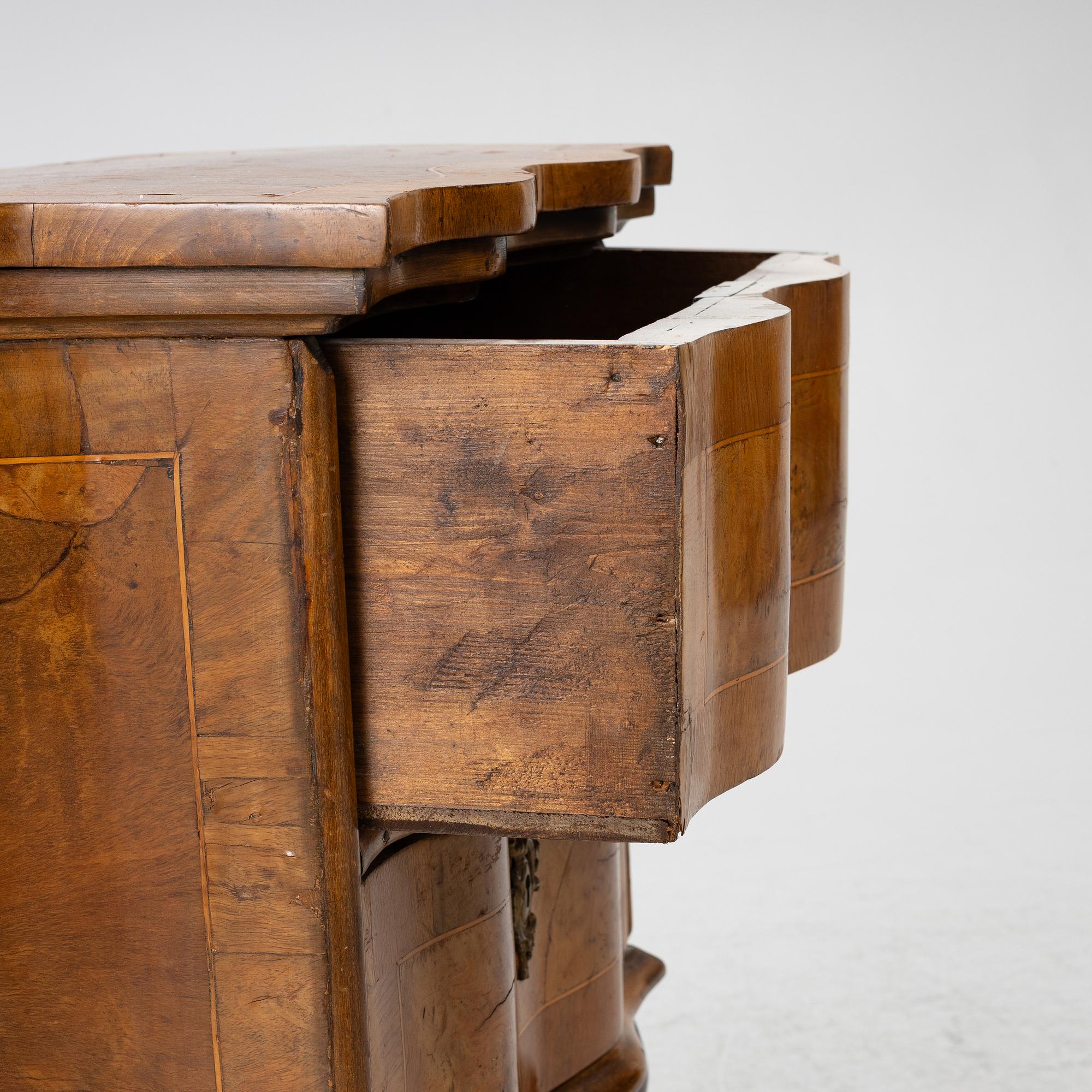 A small neo-Rococo chest of drawers, 19th century.