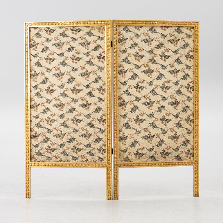 A Louis XVI style folding screen, circa 1900, with fabric from the 18th century.