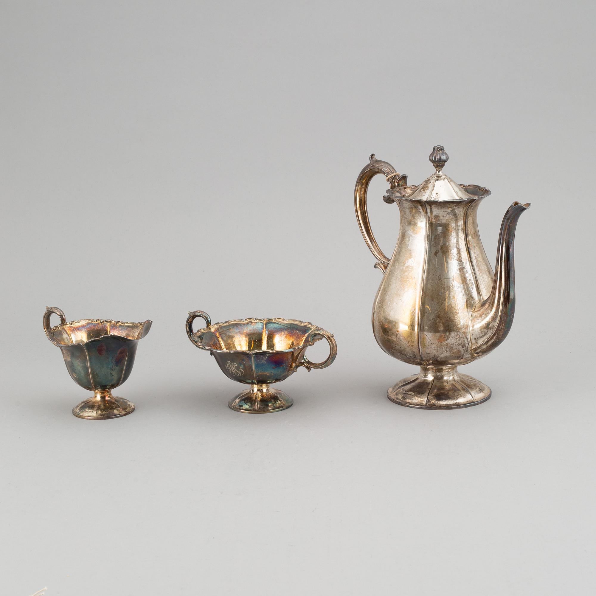 A silver coffee pot, creamer and sugar bowl. Kultakeskus Oy, Hämeenlinna, Finland 1943.