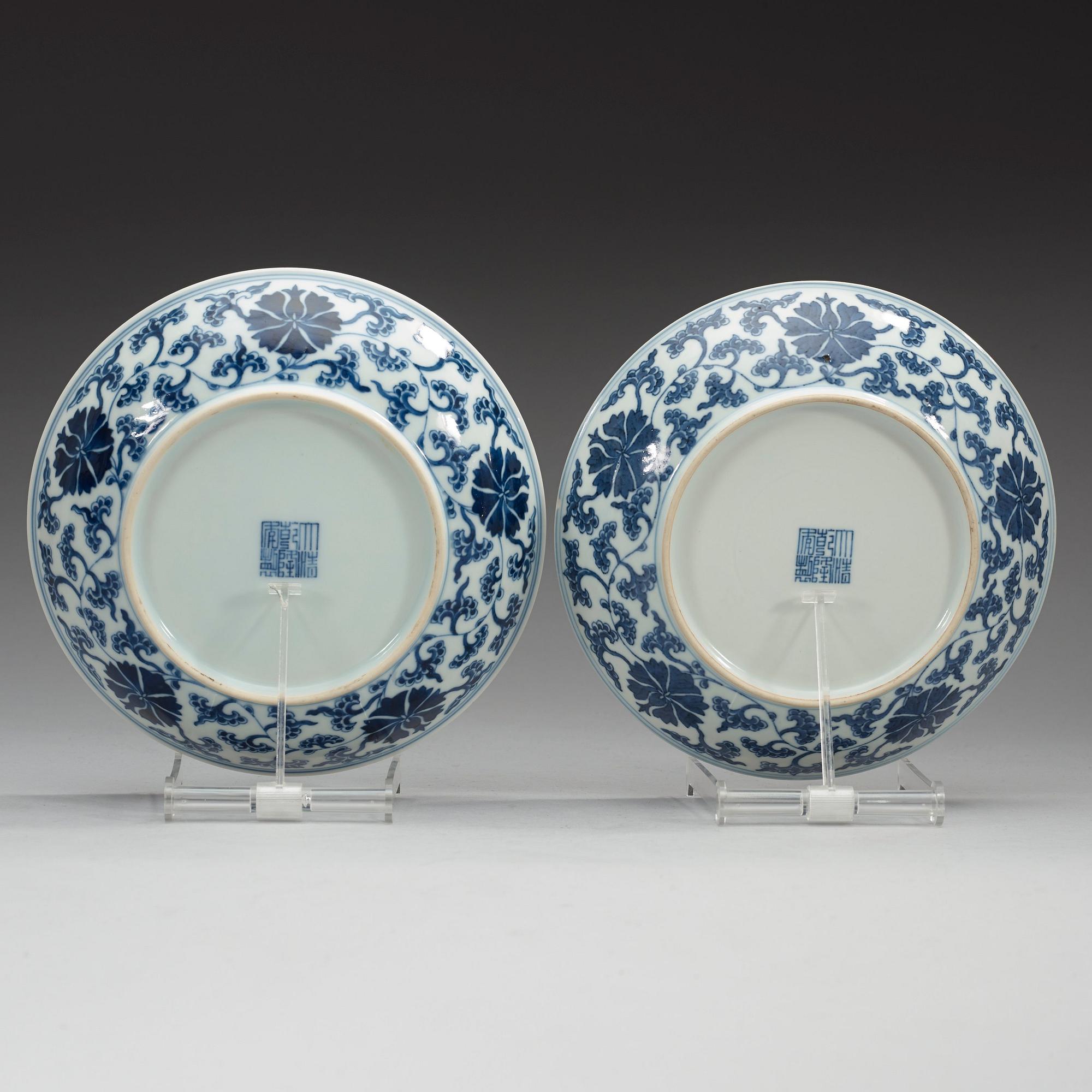 A pair of blue and white lotus dishes, Qing dynasty with Qianlong seal mark.