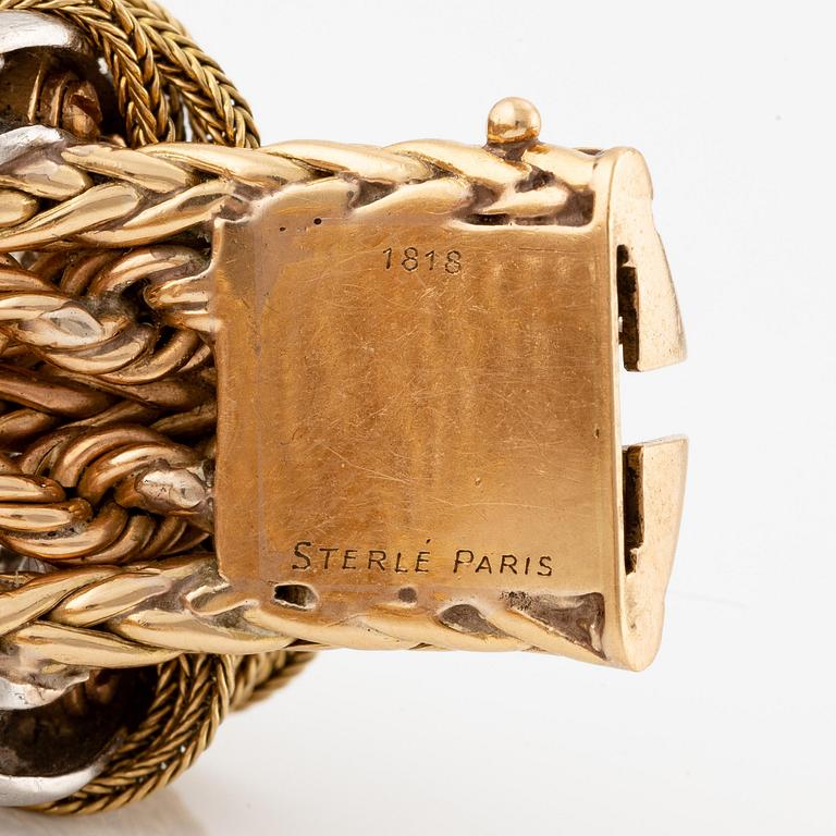 A Sterlé bracelet in 18K gold and platinum with round brilliant-cut diamonds.