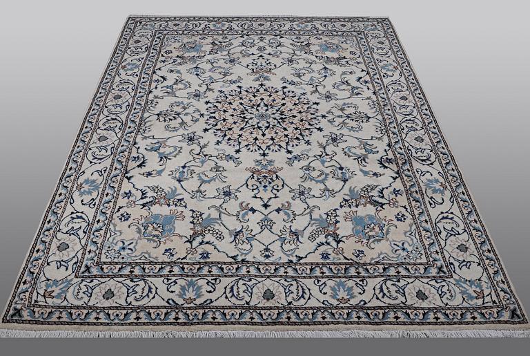 A rug, Nain, part silk, 238 x 163 cm.