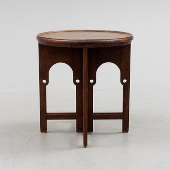 NORDISKA KOMPANIET, an Art Nouveau copper and oak smoking table, 1913.