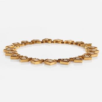 An Ilias Lalounis 18K gold necklace set with eight-cut diamonds.