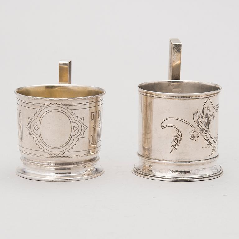 Two tea glass holders in silver, one with mark of Ivan Saltykov, Moscow 1889, the other one marked Moscow 1908-1917.