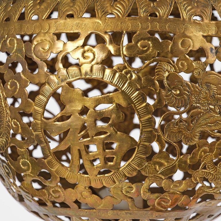 A Chinese gilt wood lantern with brass shade, Qing dynasty, 19th century.