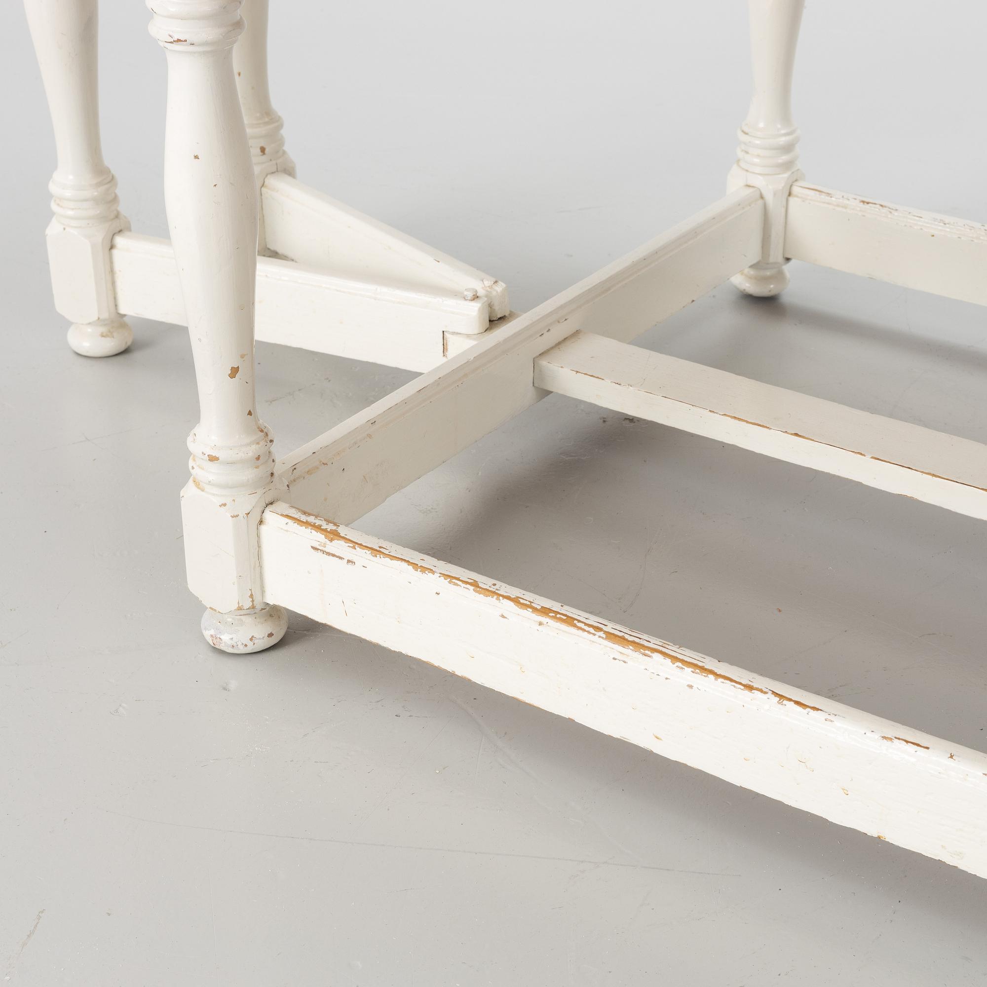 An early 20th century drop-leaf table.