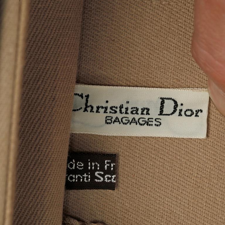 CHRISTIAN DIOR, a monogram canvas suitcase.