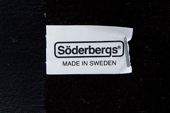 A leather swivel armchair and stool, Söderbergs  1980s.