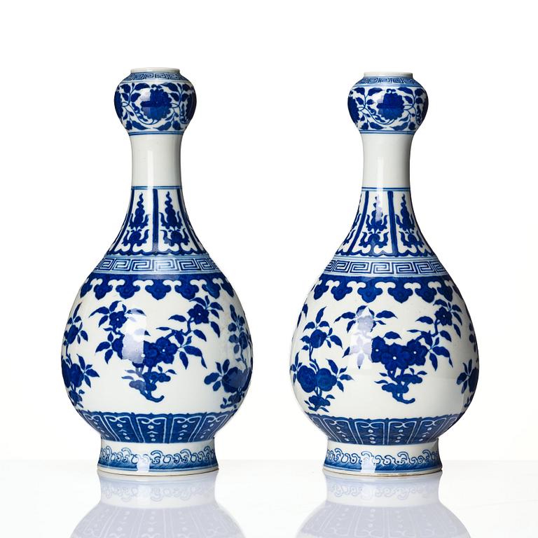 A pair of Chinese blue and white vases, late Qing dynasty/Republic with Qianlong seal mark.