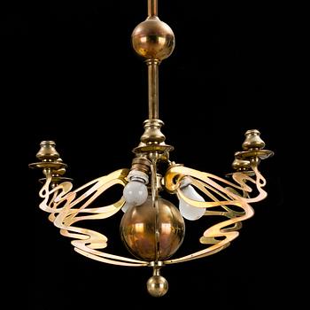 A brass Art Nouveau ceiling light, early 20th century.